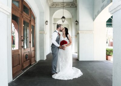 bride and groom kiss at church